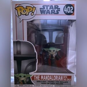 Mandolorian Star Wars funko pop holding the child 
Number 402